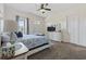 A bright primary bedroom with a queen bed, soft carpet and a view of the outdoors at 2794 Howard Ave. # D, Myrtle Beach, SC 29577
