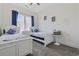 Bright bedroom with two twin beds, blue and white bedding, coastal decor, and a window with blinds at 2794 Howard Ave. # D, Myrtle Beach, SC 29577