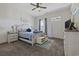 Bright bedroom with a queen size bed, soft carpet, ceiling fan and lots of natural light at 2794 Howard Ave. # D, Myrtle Beach, SC 29577