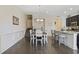 Cozy dining area with hardwood floors, chandelier, and seamless flow into the kitchen at 2794 Howard Ave. # D, Myrtle Beach, SC 29577