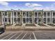 Charming multi-story townhomes with columns, balconies, palm trees, and a manicured landscape at 2794 Howard Ave. # D, Myrtle Beach, SC 29577