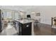 Open-concept kitchen with granite island, stainless steel appliances, and seamless flow to living area at 2794 Howard Ave. # D, Myrtle Beach, SC 29577