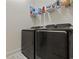 Laundry room featuring modern front-loading washer and dryer, with shelving for storage of supplies at 2794 Howard Ave. # D, Myrtle Beach, SC 29577