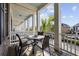 View of covered porch with patio table, chairs and a scenic view of the neighborhood at 2794 Howard Ave. # D, Myrtle Beach, SC 29577