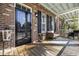 Inviting front porch featuring a seating area, decorative rug, and brick accents at 2794 Howard Ave. # D, Myrtle Beach, SC 29577