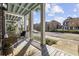 Charming porch view showcases seating area and a glimpse of the neighborhood at 2794 Howard Ave. # D, Myrtle Beach, SC 29577