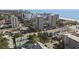 Aerial view of coastal buildings, palm trees, and the ocean at 306 74Th Ave. N # 105, Myrtle Beach, SC 29572