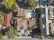 Aerial view of condo buildings, a pool, parking lots, and surrounding greenery at 306 74Th Ave. N # 105, Myrtle Beach, SC 29572
