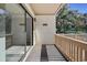 Spacious balcony with wooden railings, offering an inviting outdoor space at 306 74Th Ave. N # 105, Myrtle Beach, SC 29572