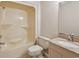 Clean bathroom with a tub and shower, a granite countertop sink, and a toilet at 306 74Th Ave. N # 105, Myrtle Beach, SC 29572