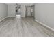 Spacious living area featuring stylish gray plank flooring and a seamless flow to other rooms at 306 74Th Ave. N # 105, Myrtle Beach, SC 29572