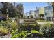 View of the Harborside community entrance showcasing coastal-style homes and lush landscaping at 306 74Th Ave. N # 105, Myrtle Beach, SC 29572