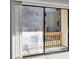 Balcony view of the community pool seen through sliding glass doors at 306 74Th Ave. N # 105, Myrtle Beach, SC 29572