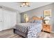 Bedroom with a wood headboard, lamps, and closet at 3308 S Ocean Blvd. # 2-A, North Myrtle Beach, SC 29582