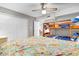 Bedroom with a double bed, bunk beds, a ceiling fan and a double closet with paneled doors at 3308 S Ocean Blvd. # 2-A, North Myrtle Beach, SC 29582