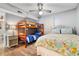Bedroom featuring a double bed and a bunk bed, with wood-look flooring, a ceiling fan and a nightstand at 3308 S Ocean Blvd. # 2-A, North Myrtle Beach, SC 29582