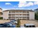 Three-story residential building with balconies and ample parking in front at 3308 S Ocean Blvd. # 2-A, North Myrtle Beach, SC 29582