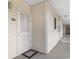 Condo exterior entrance with a white door and siding at 3308 S Ocean Blvd. # 2-A, North Myrtle Beach, SC 29582