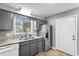 Modern kitchen featuring granite countertops, a stainless steel refrigerator and dishwasher at 3308 S Ocean Blvd. # 2-A, North Myrtle Beach, SC 29582