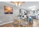 Cozy eat-in kitchen with stainless appliances, granite counters, and a dining table with glass top at 3308 S Ocean Blvd. # 2-A, North Myrtle Beach, SC 29582