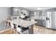Updated kitchen with stainless steel appliances and a spacious granite countertop bar at 3308 S Ocean Blvd. # 2-A, North Myrtle Beach, SC 29582