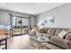 Comfortable living room with neutral tones, patio access, and views of the outdoor area at 3308 S Ocean Blvd. # 2-A, North Myrtle Beach, SC 29582