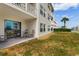 Ground floor patio with a view of a grassy area and neighboring buildings at 3308 S Ocean Blvd. # 2-A, North Myrtle Beach, SC 29582