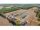 Aerial view of new construction neighborhood featuring pond, trees, and sidewalks at 342 Barn Owl Way, Conway, SC 29527