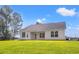 Backyard features a covered patio and sprawling green lawn at 342 Barn Owl Way, Conway, SC 29527