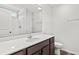 Bathroom featuring a large mirror, wood-look floor, shower, and toilet at 342 Barn Owl Way, Conway, SC 29527