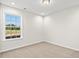 Bright bedroom with plush carpeting and a large window overlooking the backyard at 342 Barn Owl Way, Conway, SC 29527