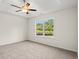 Spacious bedroom with plush carpet, ceiling fan, and a large window with backyard views at 342 Barn Owl Way, Conway, SC 29527