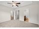 Main bedroom featuring a ceiling fan with access to a walk-in closet and ensuite bathroom at 342 Barn Owl Way, Conway, SC 29527