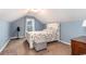 Comfortable bedroom with a floral comforter, a white bed frame, and a charming side table at 342 Palm Terrace Loop, Conway, SC 29526