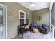 Inviting screened porch featuring comfortable seating and a peaceful outdoor ambiance at 342 Palm Terrace Loop, Conway, SC 29526