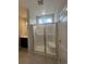 Bright bathroom featuring a glass-enclosed shower with a bench, a modern vanity, and ample lighting for a spa-like experience at 360 Kapalua Loop, Little River, SC 29566