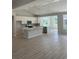 Spacious kitchen features sleek cabinets, pendant lighting, stainless appliances, and a center island with quartz countertops at 360 Kapalua Loop, Little River, SC 29566