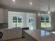 Gourmet kitchen featuring stainless appliances, bright windows and expansive countertops at 360 Kapalua Loop, Little River, SC 29566