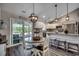 Open concept dining area, part of the kitchen, featuring a stylish island and modern lighting fixtures at 3995 Highway 905, Conway, SC 29526