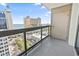 Balcony with clear glass railing overlooking an ocean view and city street at 400 20Th Ave. N # 1101, Myrtle Beach, SC 29577