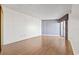 Bright room with hardwood floors, light gray walls, and balcony access at 400 20Th Ave. N # 1101, Myrtle Beach, SC 29577