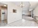 Bright dining area features tile floors, a stylish light fixture, and an adjacent pass-through window to the kitchen at 400 20Th Ave. N # 1101, Myrtle Beach, SC 29577