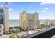 Balcony view of an oceanfront building with palm trees lining the street at 400 20Th Ave. N # 1101, Myrtle Beach, SC 29577