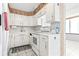 Functional kitchen featuring white appliances, classic cabinetry, and a view of the adjacent dining area at 400 20Th Ave. N # 1101, Myrtle Beach, SC 29577