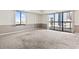 Neutral living room with carpet, a window, and balcony access with city views at 400 20Th Ave. N # 1101, Myrtle Beach, SC 29577