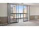 Carpeted living room featuring a balcony access with an ocean view at 400 20Th Ave. N # 1101, Myrtle Beach, SC 29577