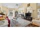 Bright and airy living room features a vaulted ceiling, hardwood floors, and access to outdoor patio at 413 Gouchos Ln., Myrtle Beach, SC 29588