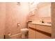 Cozy bathroom featuring a vanity, toilet, and decorative wallpaper at 415 Ocean Creek Blvd. # 2333, Myrtle Beach, SC 29572