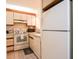 Efficient kitchen with white appliances and ample cabinet space at 415 Ocean Creek Blvd. # 2333, Myrtle Beach, SC 29572