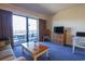 Cozy living room featuring a sliding glass door to the balcony and comfortable decor at 415 Ocean Creek Blvd. # 2333, Myrtle Beach, SC 29572